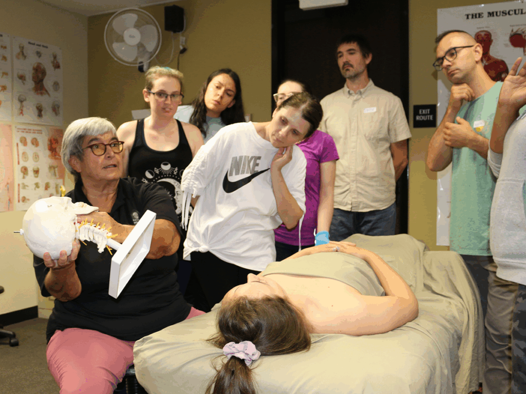 Massage Instructor doing a demonstration for class